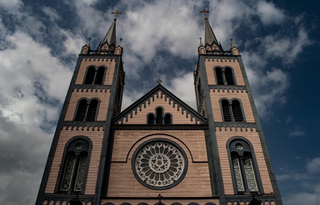 the-saint-peter-and-paul-cathedral-in-pamaribo-suriname-6673095 Exterior view of St. Peter and Paul Cathedral showcasing its gothic architecture and twin towers in Suriname.